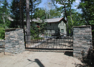 scrollwork in slide gate with masonry columns