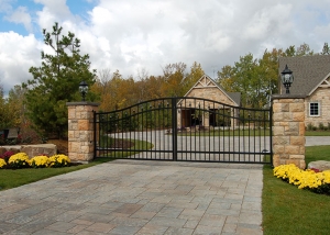 swing gate with masonry columns estate home