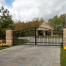 swing gate with masonry columns estate home