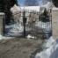 Swing Gate with scrollwork and masonry columns